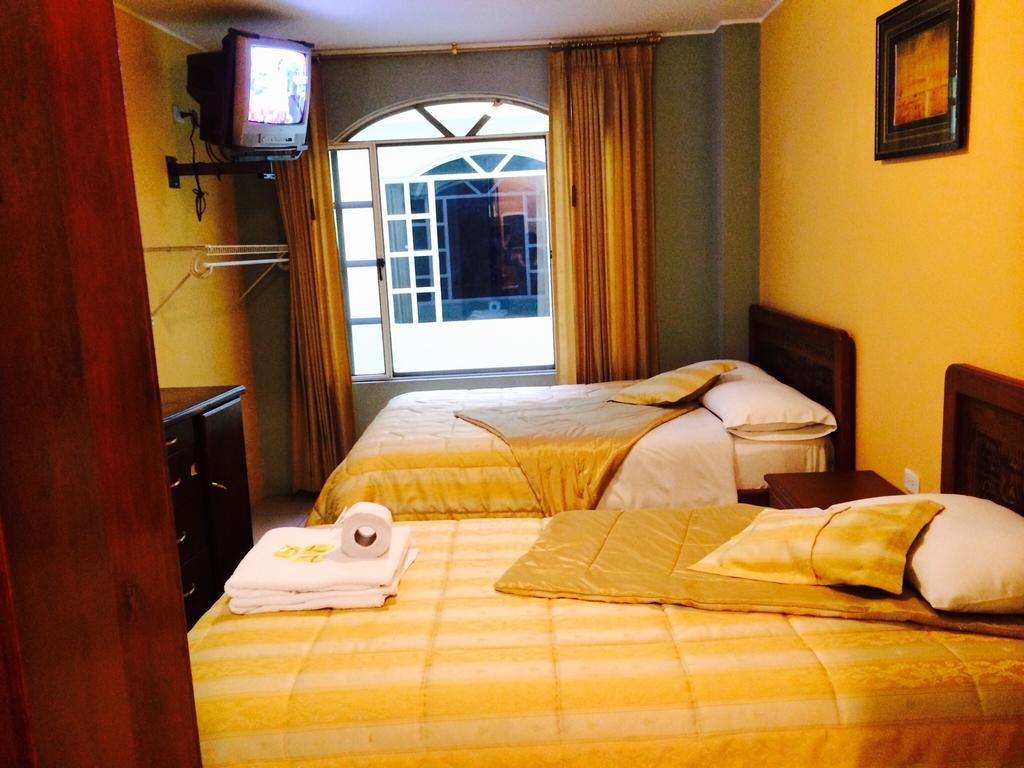 Hostal Grand Rio Баньйос Номер фото