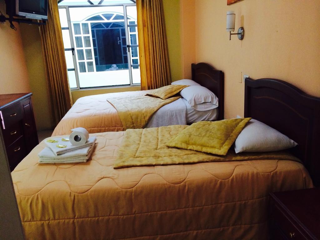 Hostal Grand Rio Баньйос Номер фото